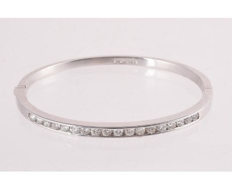 
	
		A DIAMOND HINGED BANGLE 
		The polished hinged bangle set with brilliant cut diamonds, approximately 1.26 carats total, 