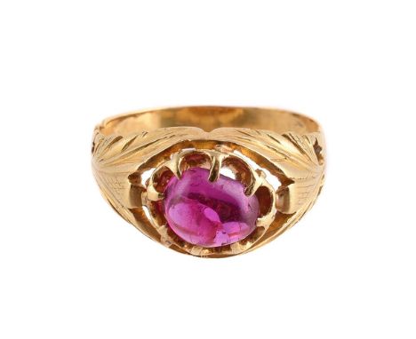 
	
		A RUBY SINGLE STONE RING 
		The cabochon ruby within a raised claw setting, to foliate chased gold coloured shoulders an