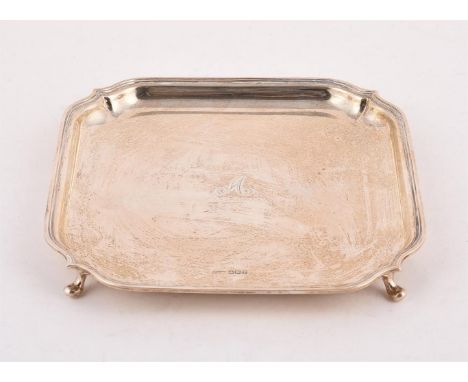 
	
		A SILVER SHAPED SQUARE SALVER
		MAKER&#39;S MARK G. M. &amp; S., SHEFFIELD 1934
		With a raised moulded border, engraved