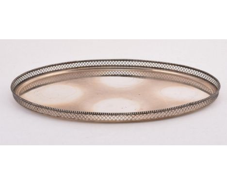 A DUTCH SILVER OVAL GALLERIED TRAY .833 STANDARD, CIRCA 1922 With a beaded border and pierced with a loop band 33cm (13in) lo