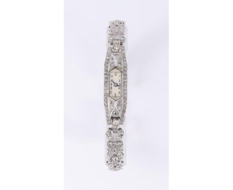 
	
		UNSIGNED
		A LADY&#39;S PRECIOUS WHITE METAL AND DIAMOND COCKTAIL WATCH
		Movement: Swiss manual wind, 15 jewels
		Case:
