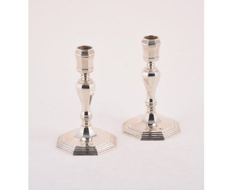 
	
		A PAIR OF SILVER CANDLESTICKS
		MAKER&#39;S MARK F.G, LONDON 1963
		With octagonal capitals, baluster stems and octagona