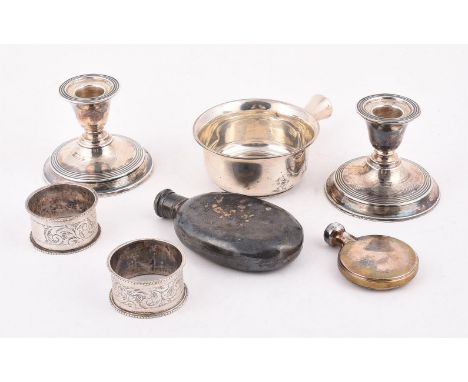 
	
		A COLLECTION OF SILVER ITEMS
		To include: a pair of Edwardian dwarf candlesticks, maker&#39;s mark H. H. &amp; S, Birmi