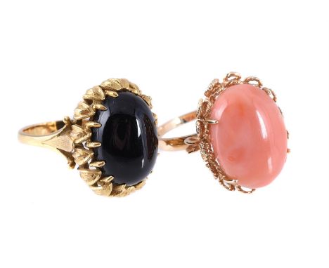 
	
		Y&nbspTWO GEM-SET DRESS RINGS
		The first set with an oval cabochon onyx within a foliate claw mount, between fleur-de-l