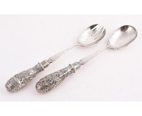 
	
		A PAIR OF CHINESE SILVER SALAD SERVERS 
		LUEN WO, SHANGHAI 1880 - 1940
		With chased foliate baluster handles
		29.5cm 