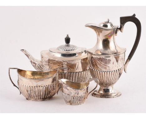 
	
		A MATCHED SILVER FOUR PIECE OVAL TEA SET
		THE TEA POT BY HARRODS LTD., SHEFFIELD 1929, THE HOT WATER POT BY BARKER BROT