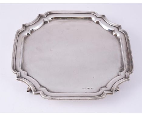 
	
		A SILVER SHAPED SQUARE SALVER
		VINER&#39;S LTD., SHEFFIELD 1943
		With a raised moulded border and on four scroll feet
