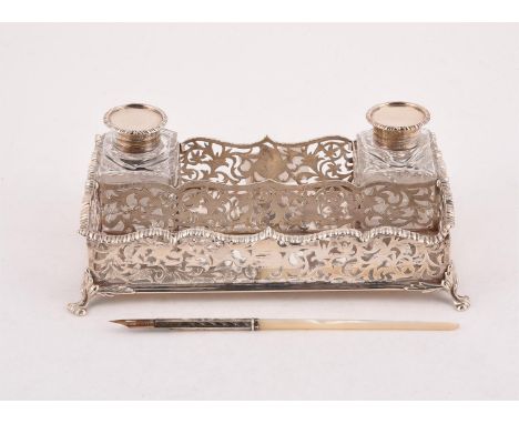 
	
		Y&nbspA VICTORIAN SILVER RECTANGULAR INK WELL
		CHARLES STUART HARRIS, LONDON 1888
		With a gadrooned border, pierced fo