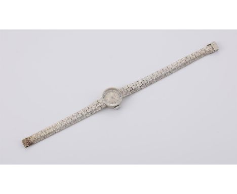 
	
		BUECHE GIROD 
		A LADY&#39;S 9 CARAT WHITE GOLD BRACELET WATCH, CIRCA 1965
		Movement: Manual wind, 17 jewels
		Case: Wh