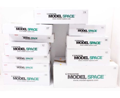 11 boxes of Deagostini 1/8th scale parts and kits to build a 1/8th scale Porsche 911 Carrera 2.7, all as issued, the sequence