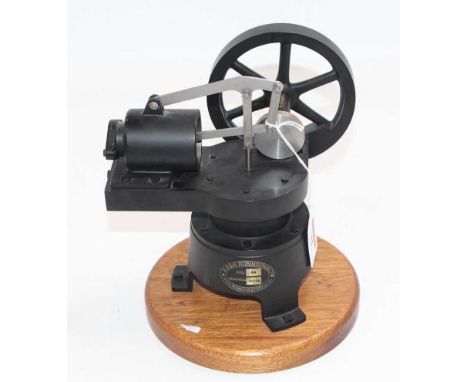 A.E and H Robinson Size B4 Stationary hot air Stirling cycle engine finished in black and fully raised on wooden display plin
