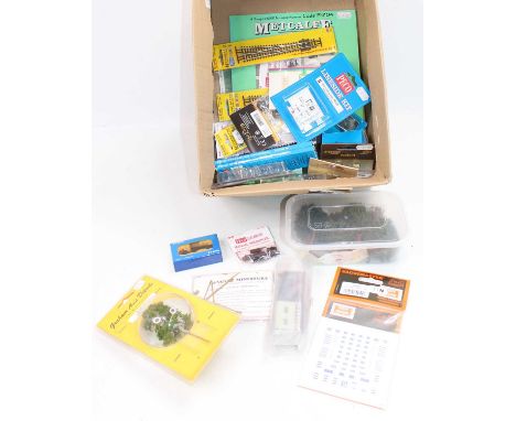N gauge accessories including 8 assorted points (E-M); point motor mounting plates; 8 manual uncouplers; 2 buffers; couplings