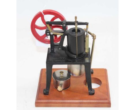 A well-engineered model of a Rider Ericsson spirit fired hot air engine, with spirit burner, fully raised on wooden display p