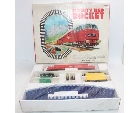 ‘Mighty Red Rocket’ Hymek diesel goods set. This is a Hong Kong pirate version of the Triang Big Big train. Loco red with whi