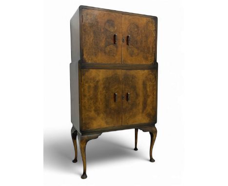 Early 20th century burr walnut cocktail cabinet, the upper double doors enclosing a fitted interior with mirrored back, over 