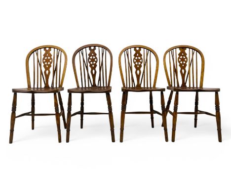 Set of four elm and beech Windsor dining chairs, hoop and stick back with pierced wheel splat, dished seat on turned supports