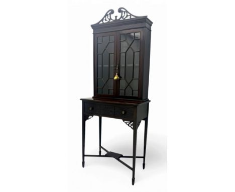 Chippendale design mahogany display cabinet, the upper section with astragal glazed doors and a carved crest, the base with a
