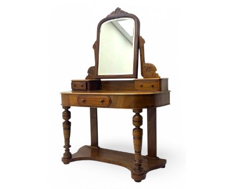 Late Victorian mahogany Duchess dressing table, the arched top bevelled mirror mounted by floral carving, on shaped horns dec