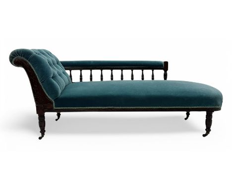 Late Victorian mahogany framed chaise longue, upholstered in turquoise buttoned fabric, the upholstered rail on turned balust
