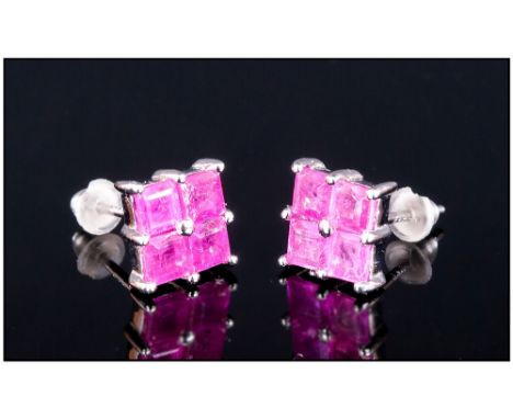 Ruby Square Stud Earrings, each stud of 1ct, the four square cut rubies set closely with one central prong, in platinum verme