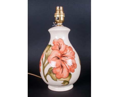 Moorcroft Lamp Base 'Coral Hibiscus' On Cream Ground. Impressed Moorcroft mark to base. Stands 10'' in height 