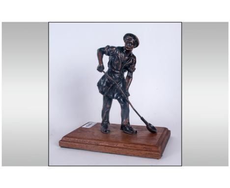 Bronzed Figure Of An Iron Founder Holding A Metal Ladle on wooden base. 12'' in height.
