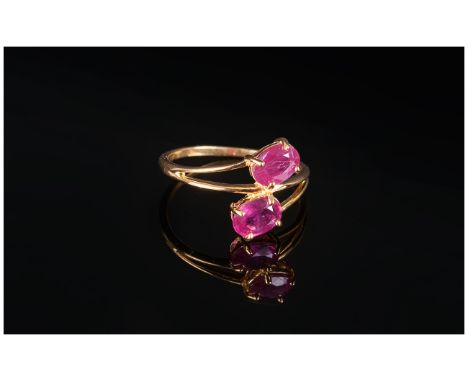 Ruby Crossover Ring, two oval cut rubies, totalling 2.5cts, set in 14ct gold vermeil and silver, in a flattering crossover st