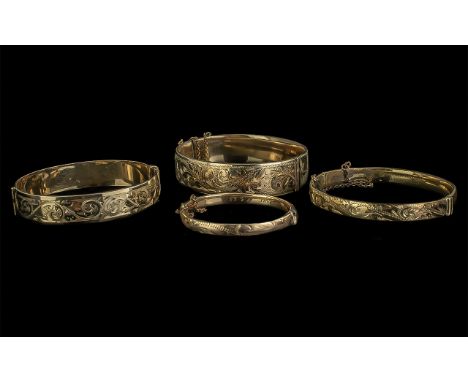 4 Gold Bangles. Gold Bangles with Metal Core, 1/5 with Metal Core, Large 1/5 9ct Gold with Metal Core, 9ct Rolled Gold and a 