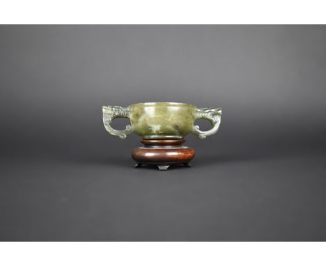 A Chinese Spinach Jade Archaic Two Handled Cup, The Handles Carved in the Form of Dragon Masks, 12x3.5cm High on Unrelated Tu