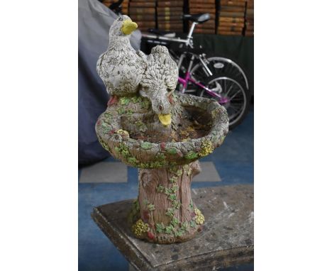 A Reconstituted Stone Garden Bird Bath, Modelled with Trunk Support and Two Ducks 