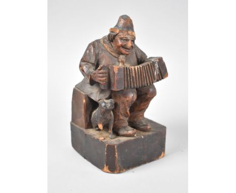 A Vintage Hand Carved Black Forest Figure of Seated Man Playing Accordion with Dog, Some Chips and Losses, 15.5cms High 