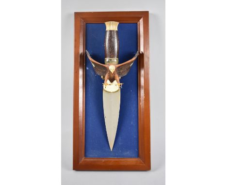 A Wall Hanging American Dagger, Guard in the Form of an Eagle, Framed 45x22cms, Dagger 36cms 
