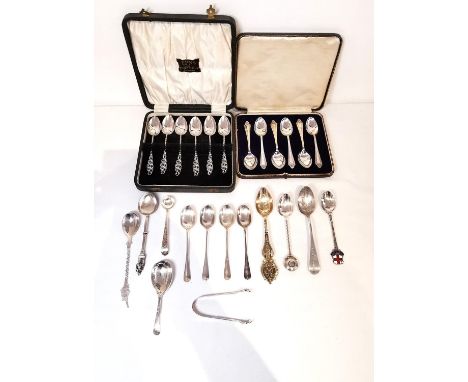 A collection of 19th and 20th century silver tea and coffee spoons, including two boxed sets of silver teaspoons, sugar tongs