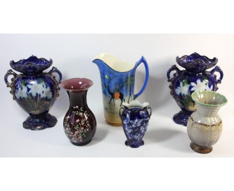 A pair of early 20th Century twin handled glazed ceramic vases, together with a similar smaller example, a Falconware Tunis w
