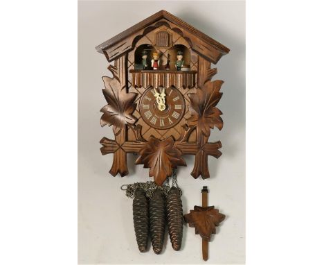 A German carved softwood cuckoo wall clock, with Regula, West Germany movement and Swiss Musical movement, playing Edelweiss,