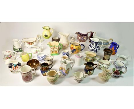 A collection of mid 20th Century and later ceramic jugs makers to include, Royal Albert, Royal Doulton and others. (2) 