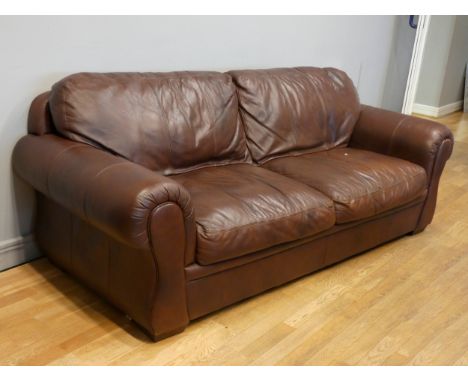 A modern three seater dark brown leather sofa. 230cm x 90cm x 98cm Overall condition is good, some small marks on top left co