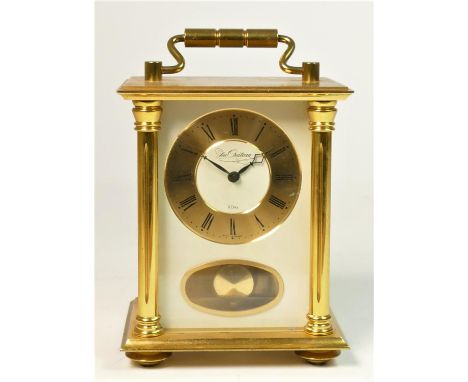 A Du Chateau West German 8 day brass carriage clock, striking on a bell, gilt dial with Roman numeral dial, 13cm 