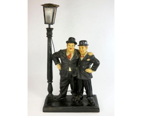 A Laurel and Hardy illuminated figure, depicting the comic duo embracing under a street light, 78cm tall, together with anoth