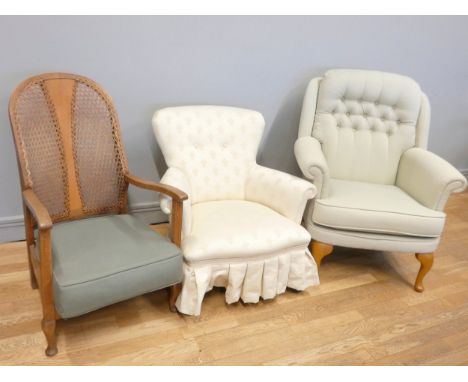 A button backed armchair, upholstered in a floral patterned fabric, padded seat, cabriole legs, 106cm tall, together with a s