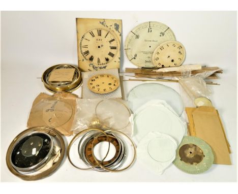 A collection of mantle clock glass and pendulums 