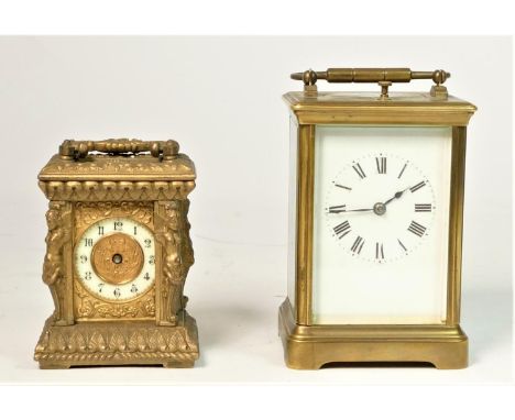 A gilt brass timepiece, with ornate cast case, 8cm together with an unmarked 1/2 hour striking and repeating brass carriage c