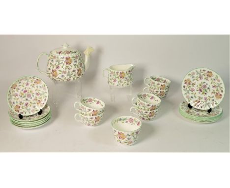A Minton 'Haddon Hall' tea service for six place settings, together with a tea pot, sugar bowel and milk jug. (21)In very goo
