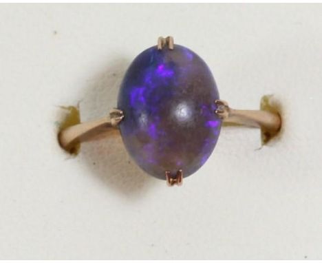 A 9ct gold and cabochon black opal ring, 12 x 8mm, black/blue colour, R, 2.8gmOverall condition is good, the stone has surfac