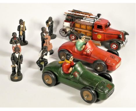 Two ceramic models of roadster race cars, together with a large tinplate model of a 1930s fire engine and a group of six jazz
