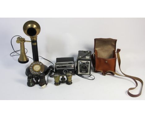 A reproduction GEC candlestick telephone, together with a Kodak Brownie camera, a Kodak instamatic camera and two pairs of bi