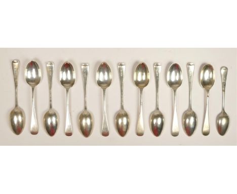 A silver set of eleven Old English pattern tea spoons, Sheffield 1910, monogramed, 244 gm, together with another silver tea s