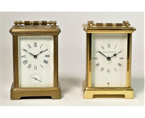 A Watches of Switzerland 8 day manual wind carriage clock 11cm, together with an unmarked manual wind alarm carriage clock 11