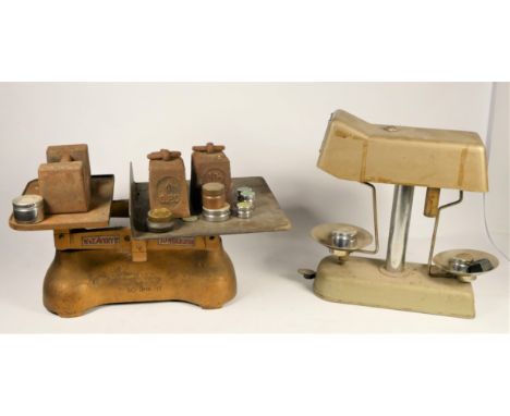 An early 20th Century G.P.O set of scales, together with a Omal 'MoneyChecker' set of scales and various sized weights. 