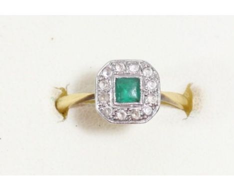 An Art Deco 18ct gold and platinum emerald and colourless stone panel ring, L, 2.6gm. 